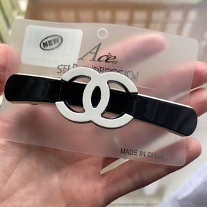 Faux black and white Chanel hair clip accessory